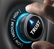 Fingers Turning Trust Dial to High